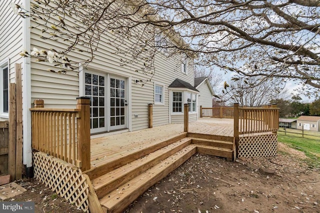 wooden terrace featuring fence