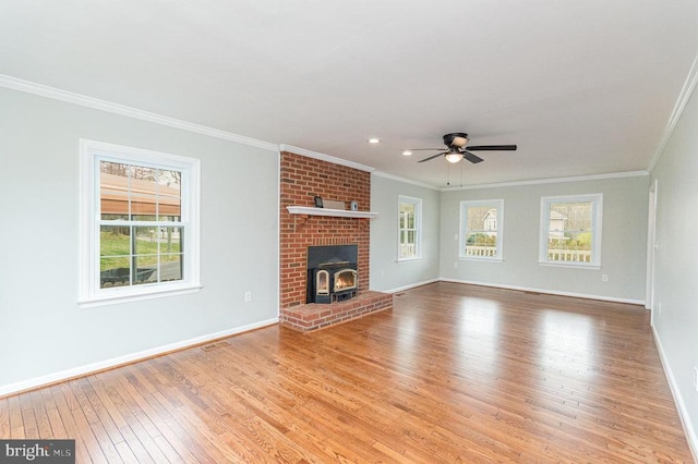 unfurnished living room featuring hardwood / wood-style floors, ornamental molding, baseboards, ceiling fan, and recessed lighting