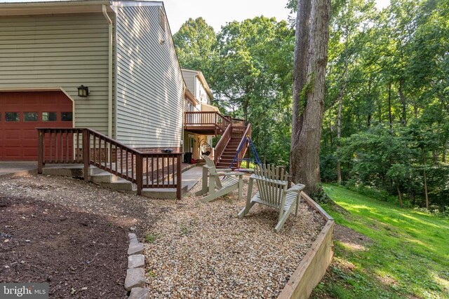 1550 Clover Dr, Fredericksburg, VA 22407 - view of yard with stairs, a wooden deck, and a garage
