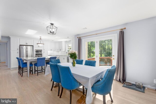 1550 Clover Dr, Fredericksburg, VA 22407 - dining room with light wood-style floors and a chandelier