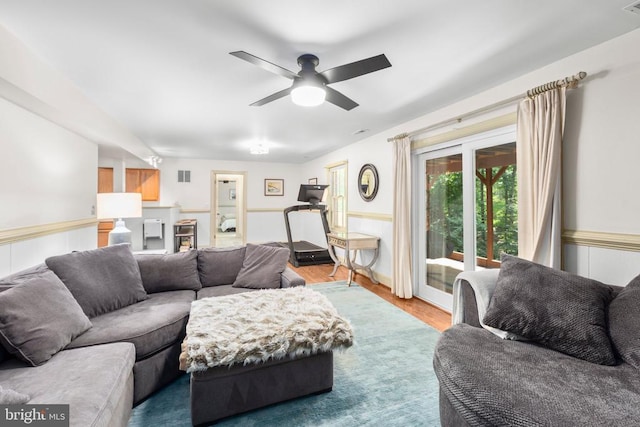 1550 Clover Dr, Fredericksburg, VA 22407 - living area with wainscoting, a ceiling fan, and wood finished floors