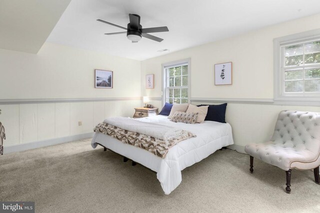 1550 Clover Dr, Fredericksburg, VA 22407 - carpeted bedroom with a wainscoted wall and ceiling fan