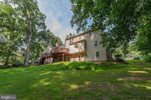 1550 Clover Dr, Fredericksburg, VA 22407 - back of property featuring a deck, a lawn, and a chimney
