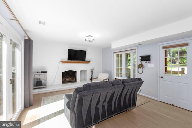 1550 Clover Dr, Fredericksburg, VA 22407 - living area with wood finished floors and a brick fireplace