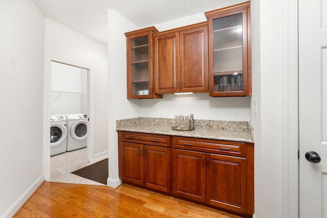 325 Petros Dr, Waynesboro, VA 22980 - laundry room featuring washer and clothes dryer, light wood-style floors, and baseboards