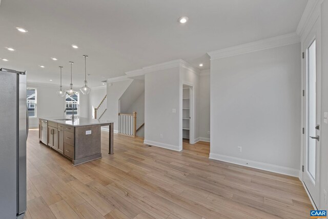 57 Hilah Ln, Charlottesville, VA 22901 - kitchen with recessed lighting, a barn door, ornamental molding, a sink, and appliances with stainless steel finishes