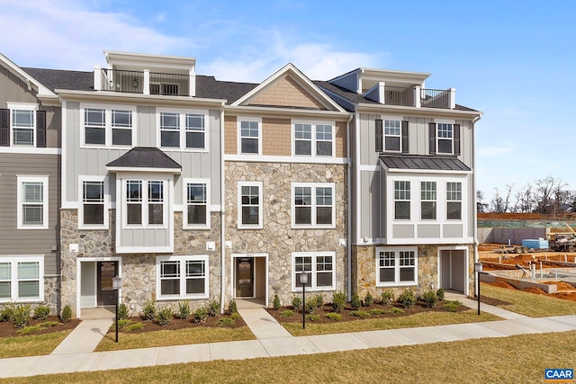 57 Hilah Ln, Charlottesville, VA 22901 - townhome / multi-family property featuring stone siding, board and batten siding, metal roof, and a standing seam roof