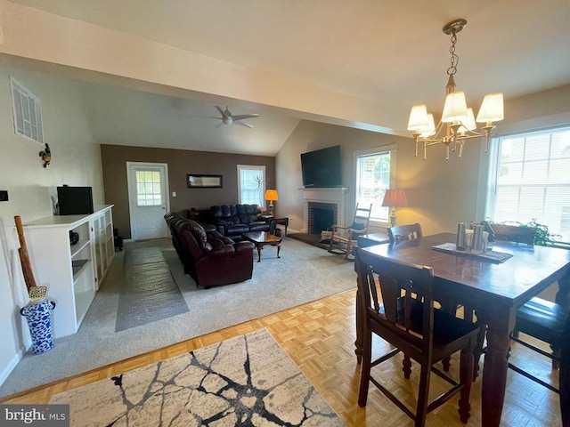 264 Fairfield Dr, Warrenton, VA 20186 - dining space featuring a fireplace, a chandelier, ceiling fan, and lofted ceiling