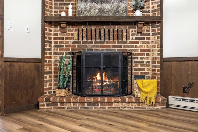 2035 Lee Jackson Hwy, Staunton, VA 24401 - detailed view of a fireplace, wood finished floors, baseboard heating, wainscoting, and wooden walls