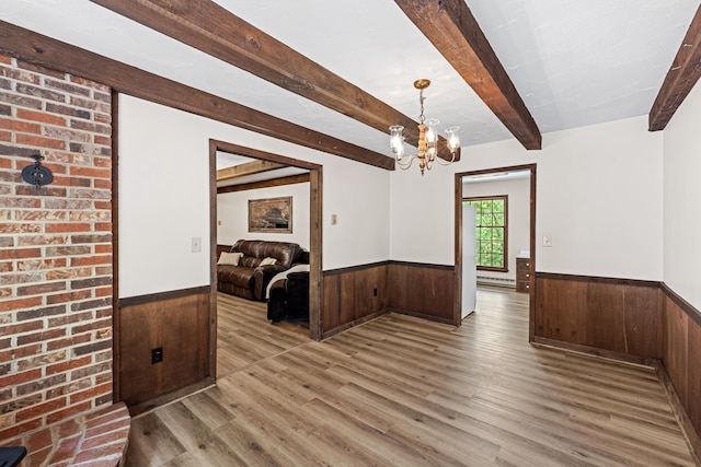 2035 Lee Jackson Hwy, Staunton, VA 24401 - dining room with wainscoting, wood walls, wood finished floors, a chandelier, and baseboard heating