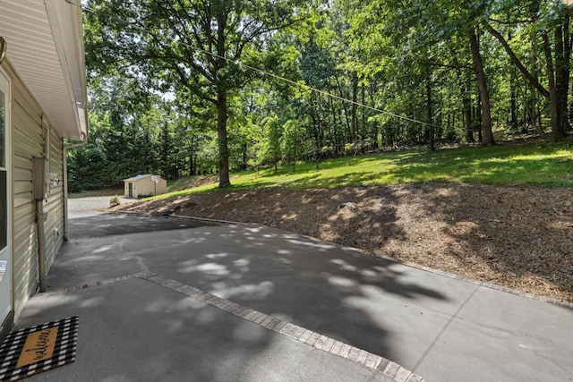 2035 Lee Jackson Hwy, Staunton, VA 24401 - view of patio featuring a storage shed and a view of trees