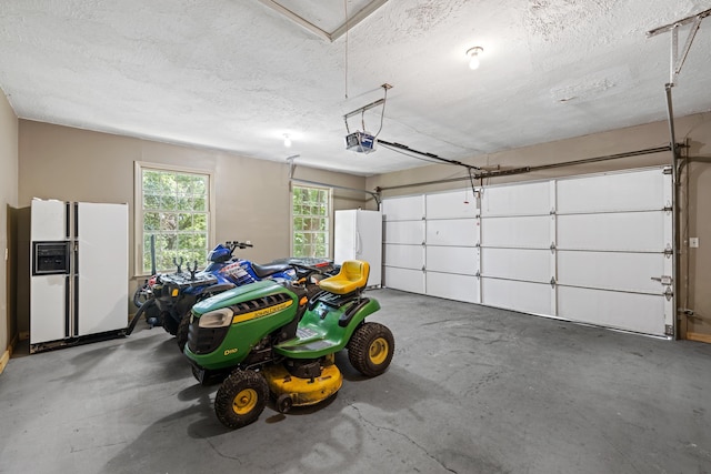 2035 Lee Jackson Hwy, Staunton, VA 24401 - garage featuring white fridge with ice dispenser, freestanding refrigerator, and a garage door opener