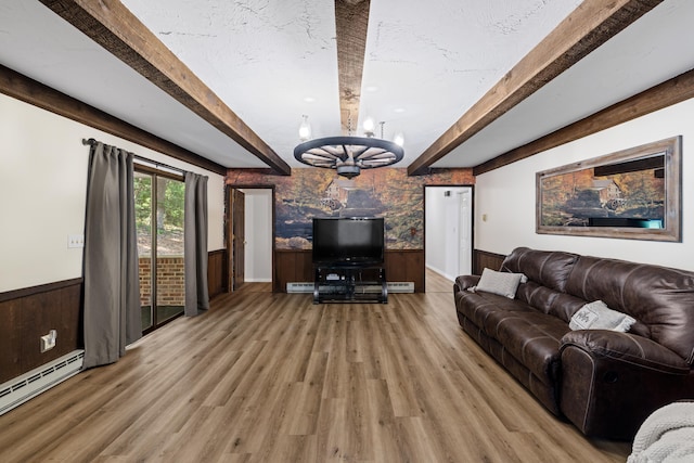 2035 Lee Jackson Hwy, Staunton, VA 24401 - living room featuring wainscoting, beamed ceiling, baseboard heating, light wood-type flooring, and a chandelier