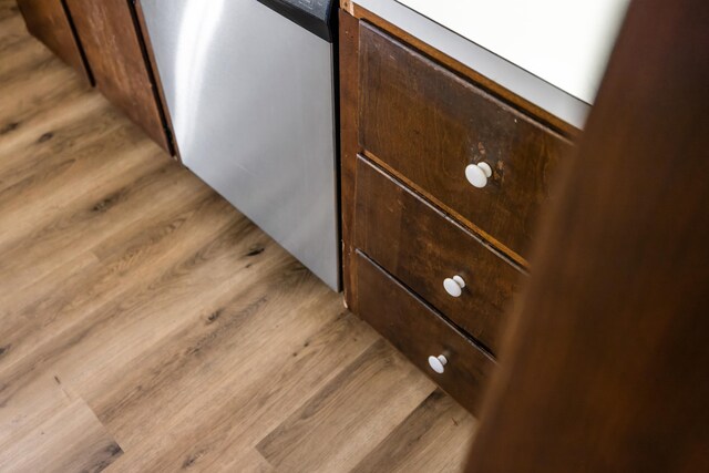 2035 Lee Jackson Hwy, Staunton, VA 24401 - kitchen view of wood finished floors, stainless steel dishwasher, and dark brown cabinetry