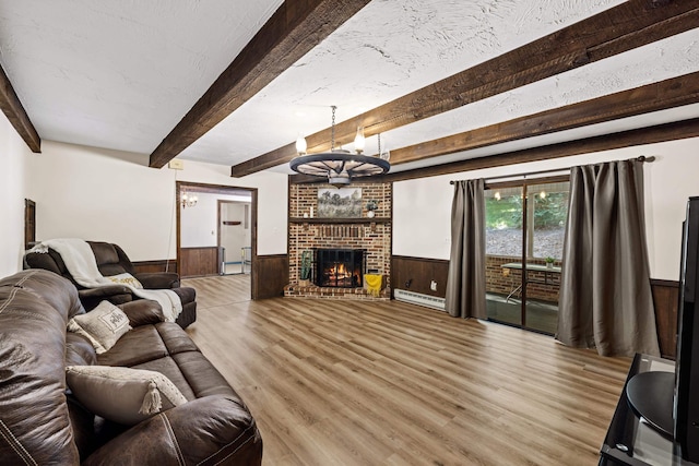 2035 Lee Jackson Hwy, Staunton, VA 24401 - living area with a wainscoted wall, wood finished floors, baseboard heating, a chandelier, and beamed ceiling
