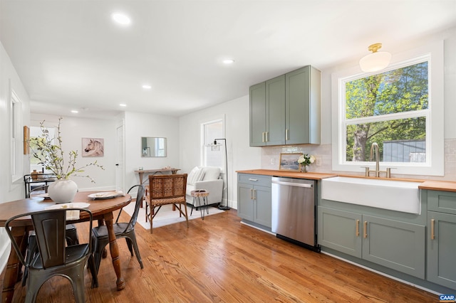 1867 Stage Junction Rd, Columbia, VA 23038 - kitchen with stainless steel dishwasher, a sink, wood counters, tasteful backsplash, and recessed lighting