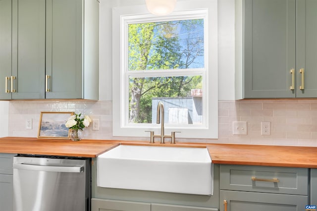 1867 Stage Junction Rd, Columbia, VA 23038 - kitchen with stainless steel dishwasher, a sink, butcher block counters, and green cabinetry