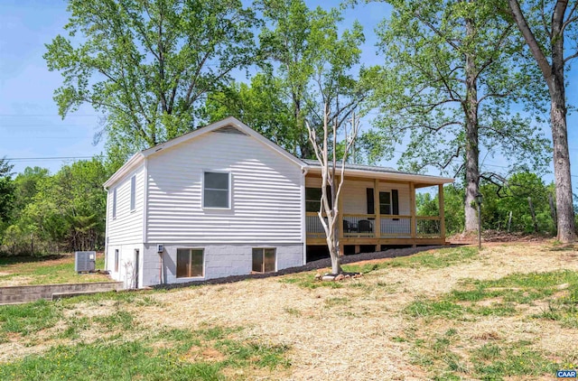 1867 Stage Junction Rd, Columbia, VA 23038 - back of house featuring central AC unit and a lawn