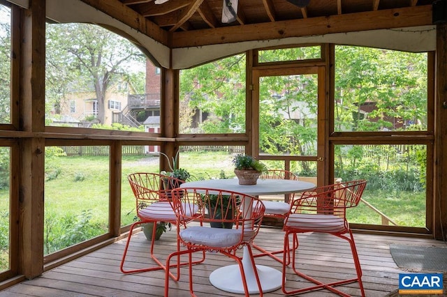 sunroom / solarium featuring outdoor dining space and plenty of natural light