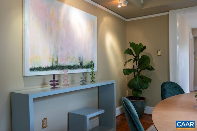 office space featuring ornamental molding, wood finished floors, and baseboards