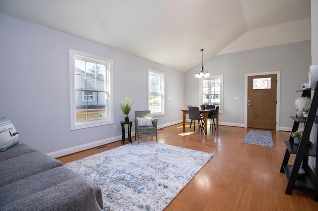 515A Grubert Ave, Staunton, VA 24401 - living room with a chandelier, wood finished floors, vaulted ceiling, and baseboards