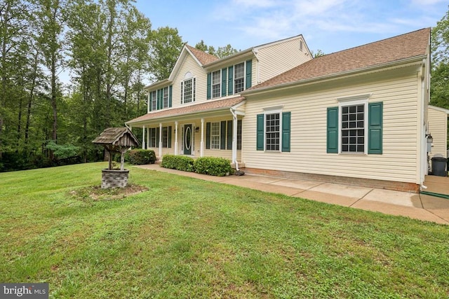  - view of front of house featuring a porch and a front yard