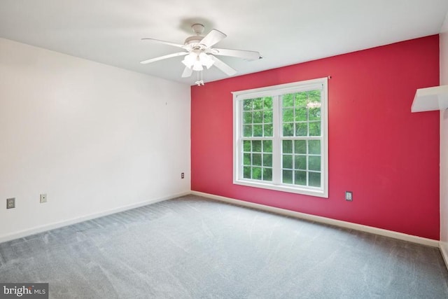  - unfurnished room with carpet flooring and a ceiling fan