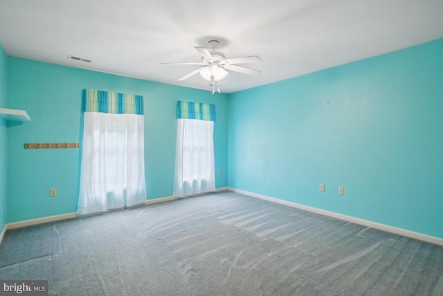 - spare room featuring carpet flooring and ceiling fan