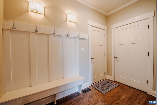 mudroom with ornamental molding, baseboards, visible vents, and wood finished floors