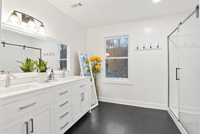 2501 Oak Grv, Mcgaheysville, VA 22840 - bathroom with visible vents, baseboards, a shower stall, and a sink