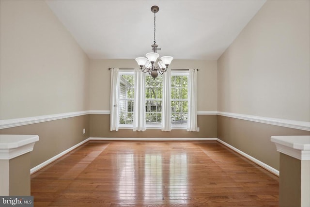 200 Saylers Creek Rd, Locust Grove, VA 22508 - unfurnished dining area with a chandelier, hardwood / wood-style flooring, baseboards, and lofted ceiling