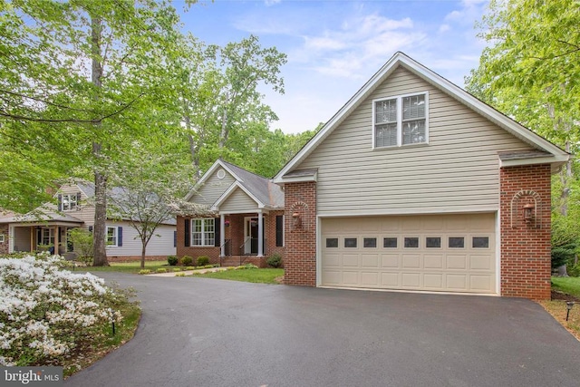 200 Saylers Creek Rd, Locust Grove, VA 22508 - traditional home featuring asphalt driveway, brick siding, and an attached garage