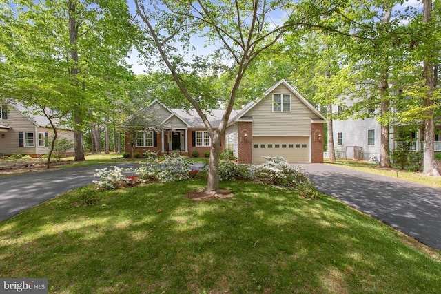 200 Saylers Creek Rd, Locust Grove, VA 22508 - view of front of property featuring asphalt driveway, brick siding, a front yard, and an attached garage