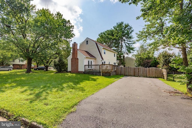 12218 Corter Ave, Fredericksburg, VA 22407 - view of property exterior with a chimney, a wooden deck, and a gate
