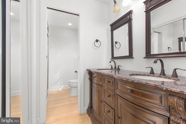 12218 Corter Ave, Fredericksburg, VA 22407 - bathroom with double vanity, wood finished floors, and recessed lighting