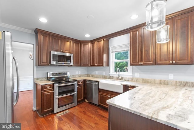 12218 Corter Ave, Fredericksburg, VA 22407 - kitchen featuring stainless steel appliances, crown molding, dark wood-type flooring, recessed lighting, and light stone counters