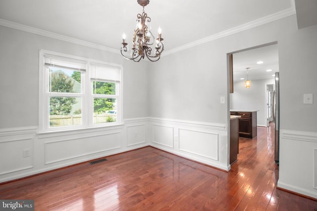 12218 Corter Ave, Fredericksburg, VA 22407 - spare room featuring a chandelier, wood-type flooring, wainscoting, and crown molding