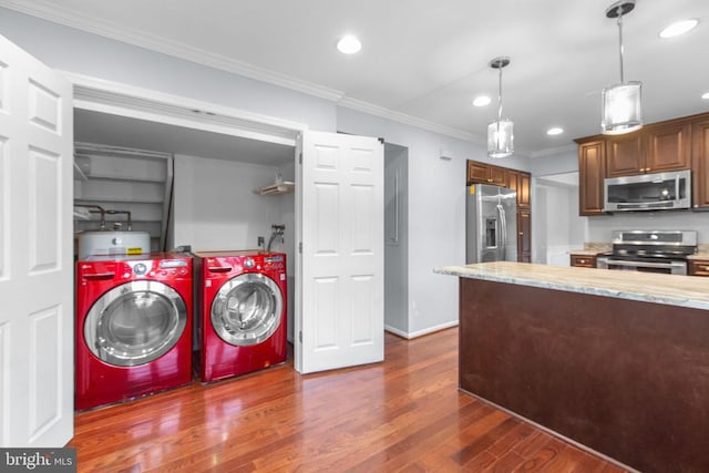 12218 Corter Ave, Fredericksburg, VA 22407 - laundry area featuring separate washer and dryer, recessed lighting, dark wood-style flooring, crown molding, and water heater