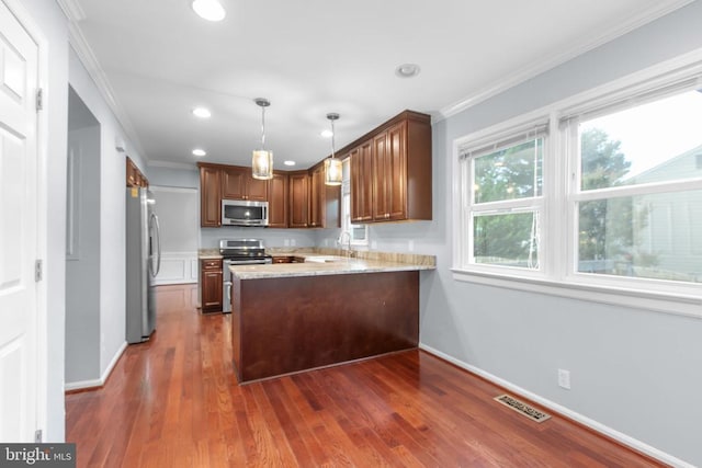 12218 Corter Ave, Fredericksburg, VA 22407 - kitchen with appliances with stainless steel finishes, a peninsula, ornamental molding, recessed lighting, and dark wood-style flooring
