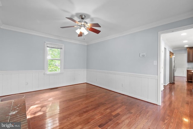 12218 Corter Ave, Fredericksburg, VA 22407 - unfurnished room with wood finished floors, a ceiling fan, wainscoting, and ornamental molding