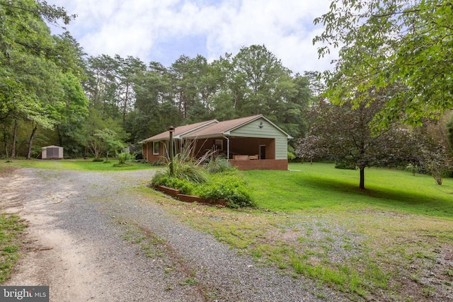 8305 Old Plank Rd, Fredericksburg, VA 22407 - view of home's exterior with driveway, a shed, and a yard