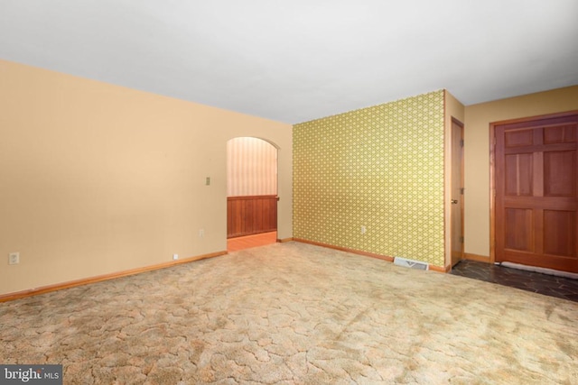 8305 Old Plank Rd, Fredericksburg, VA 22407 - carpeted spare room featuring arched walkways and wallpapered walls