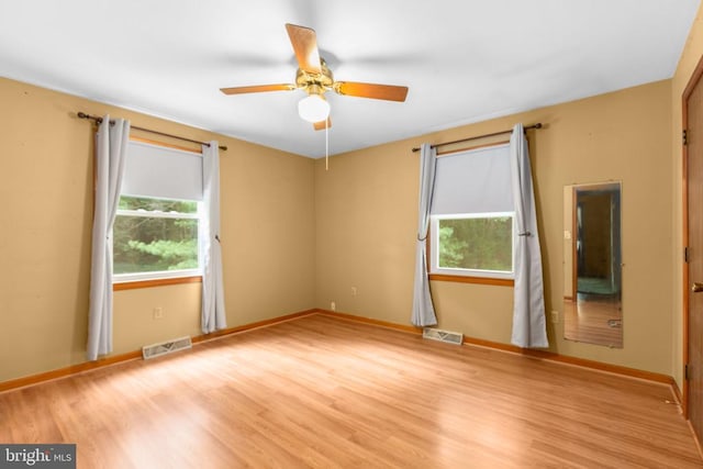 8305 Old Plank Rd, Fredericksburg, VA 22407 - spare room featuring healthy amount of natural light, wood finished floors, and a ceiling fan