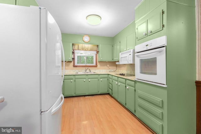 8305 Old Plank Rd, Fredericksburg, VA 22407 - kitchen with white appliances, green cabinetry, light wood finished floors, and light countertops