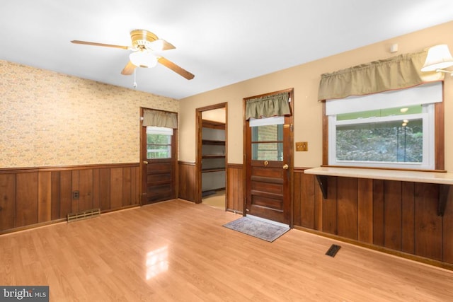 8305 Old Plank Rd, Fredericksburg, VA 22407 - entrance foyer with a wainscoted wall, wooden walls, wood finished floors, and a ceiling fan
