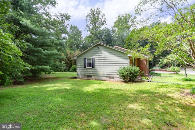 8305 Old Plank Rd, Fredericksburg, VA 22407 - view of property exterior featuring a lawn