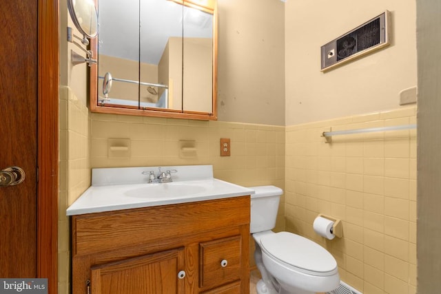 8305 Old Plank Rd, Fredericksburg, VA 22407 - bathroom featuring tile walls, vanity, and a wainscoted wall