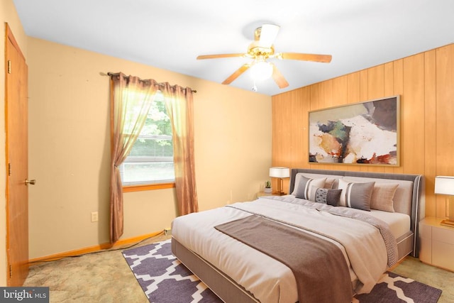 8305 Old Plank Rd, Fredericksburg, VA 22407 - bedroom with light colored carpet, wood walls, and a ceiling fan