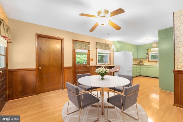 8305 Old Plank Rd, Fredericksburg, VA 22407 - dining area with wainscoting, light wood-style floors, and ceiling fan
