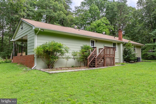 8305 Old Plank Rd, Fredericksburg, VA 22407 - rear view of property featuring a lawn and a chimney